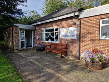 A brick building with a bench